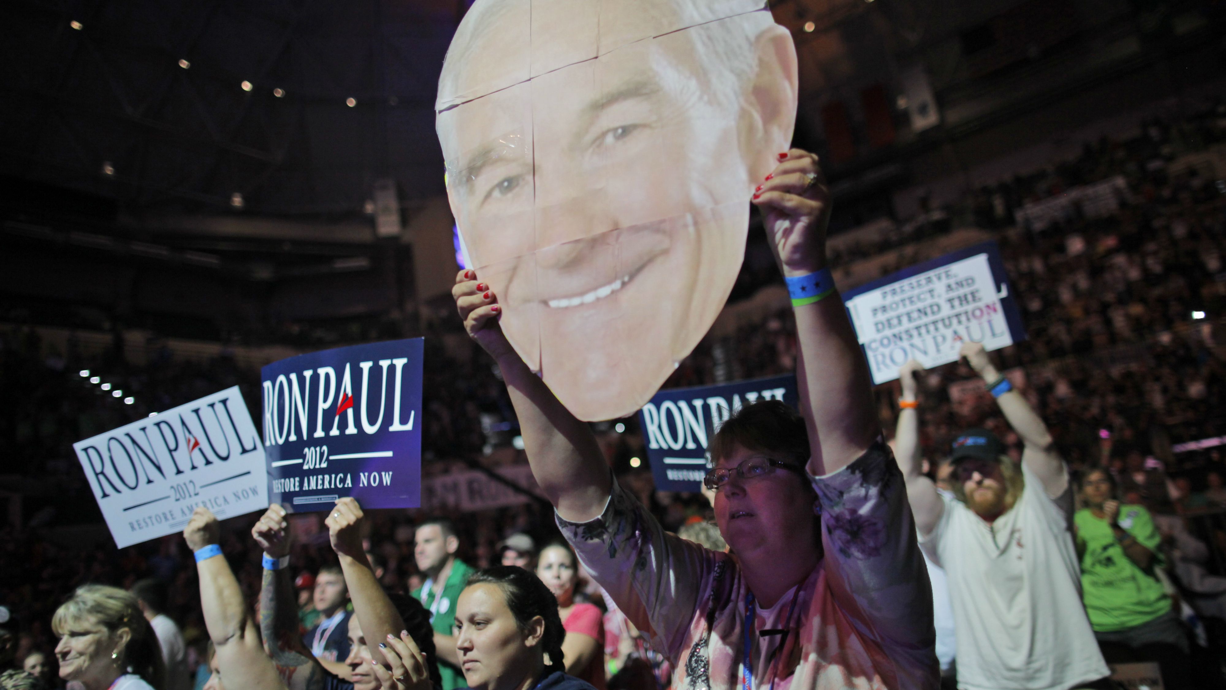 Mary White of Rathdrum, Idaho, shows her support for Rep. Ron Paul, R-Texas, at a rally at the University of South Florida Sun Dome on the sidelines of the Republican National Convention in Tampa, Fla., on Sunday, Aug. 26, 2012. 