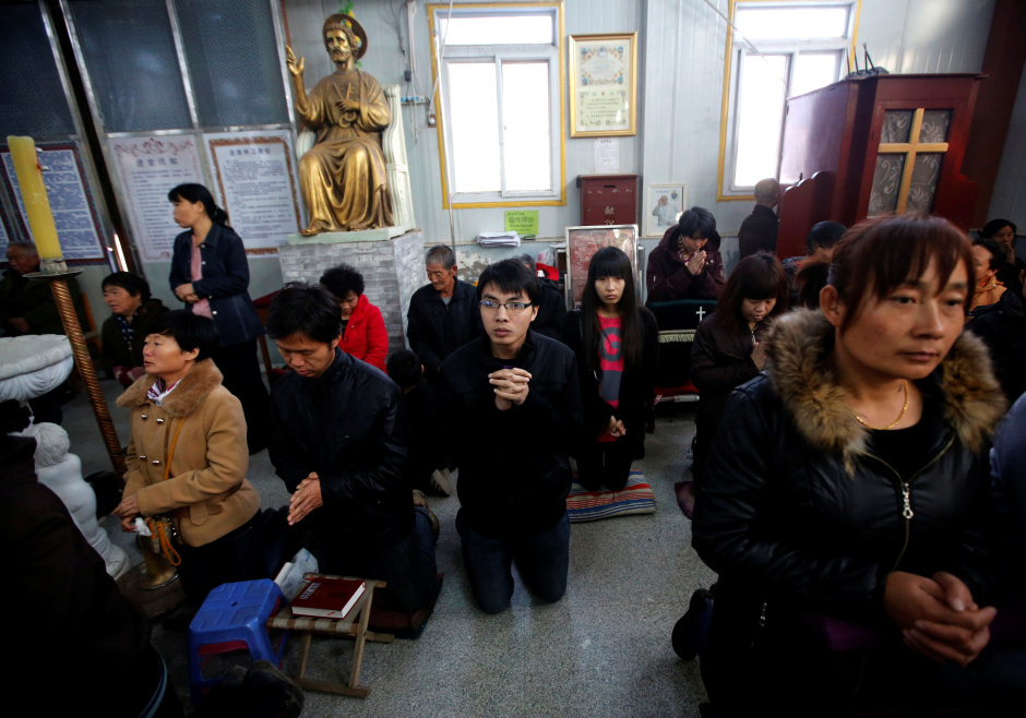Believers in an underground Catholic mass in Tianjin, China. 