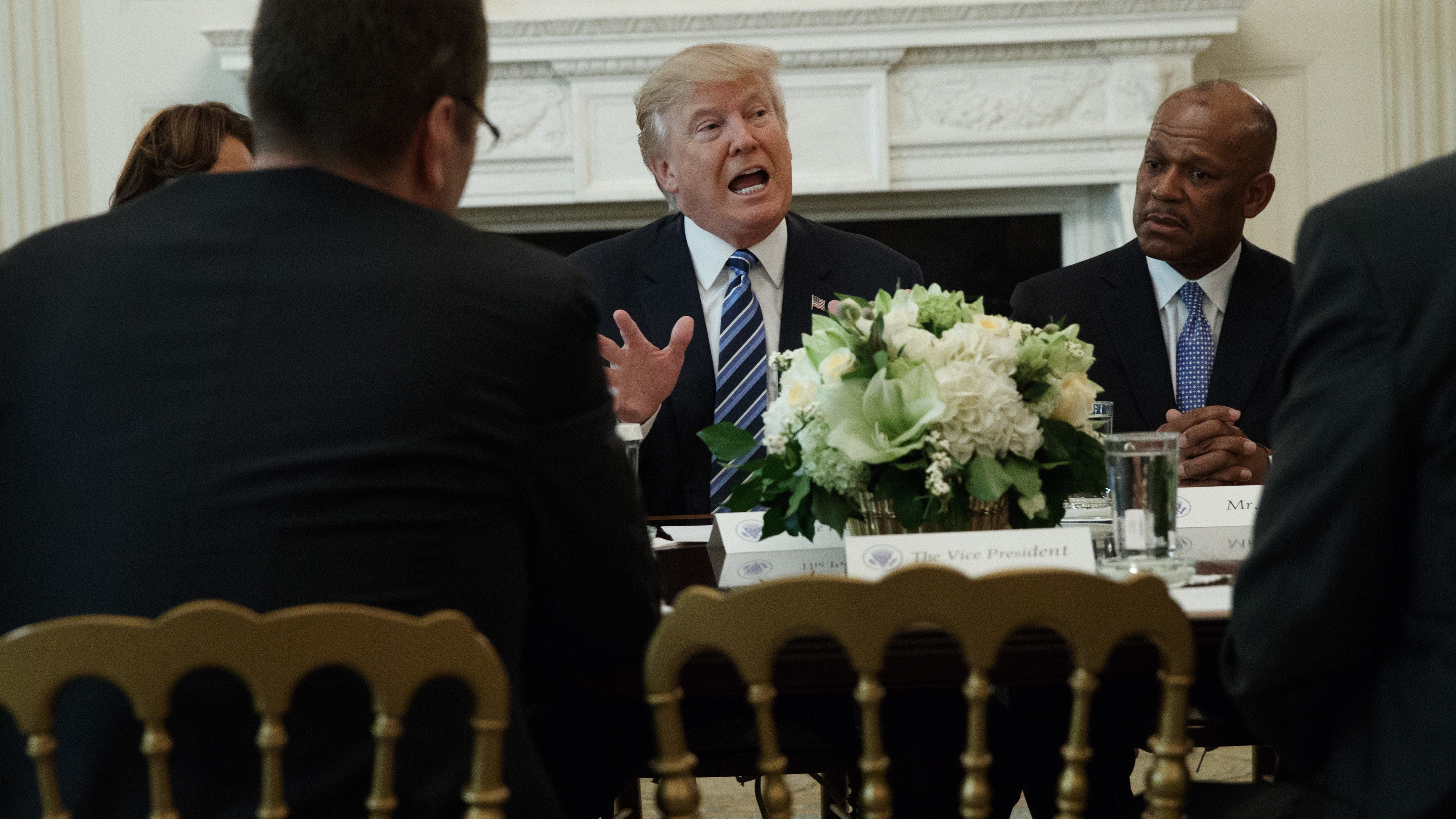 UPS President of US operations Myron Gray, right, listens as President Donald Trump speaks during a meeting with airline executives in the State Dining Room of the White House in Washington, Thursday, Feb. 9, 2017.